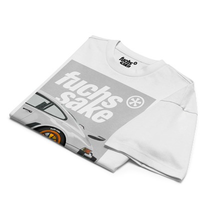 Folded white t-shirt with graphic design and text on a white background