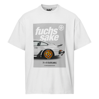 White t-shirt with a graphic of a white Porsche with orange fuchs wheels and 'fuchs sake' text on a white background