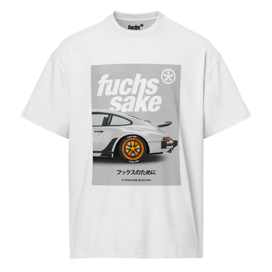 White t-shirt with a graphic of a white Porsche with orange fuchs wheels and 'fuchs sake' text on a white background