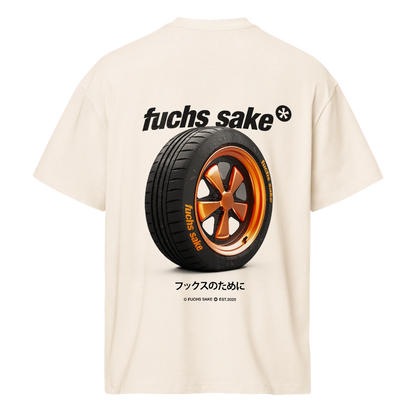 Beige t-shirt with a tire graphic and 'fuchs sake' text on a white background and fuchs sake logo