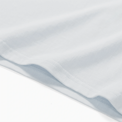 Close-up of a white fabric with subtle texture on a white background