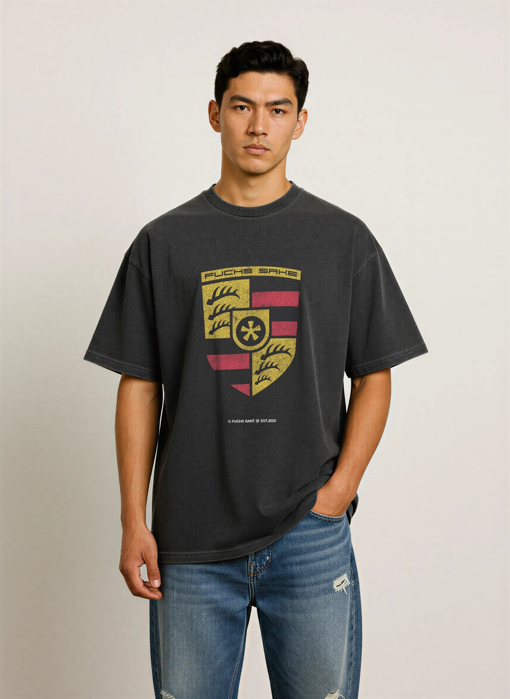 Back view of man in charcoal grey ‘fuchs sake’ T-shirt — minimalist design celebrating classic Porsche heritage and automotive lifestyle